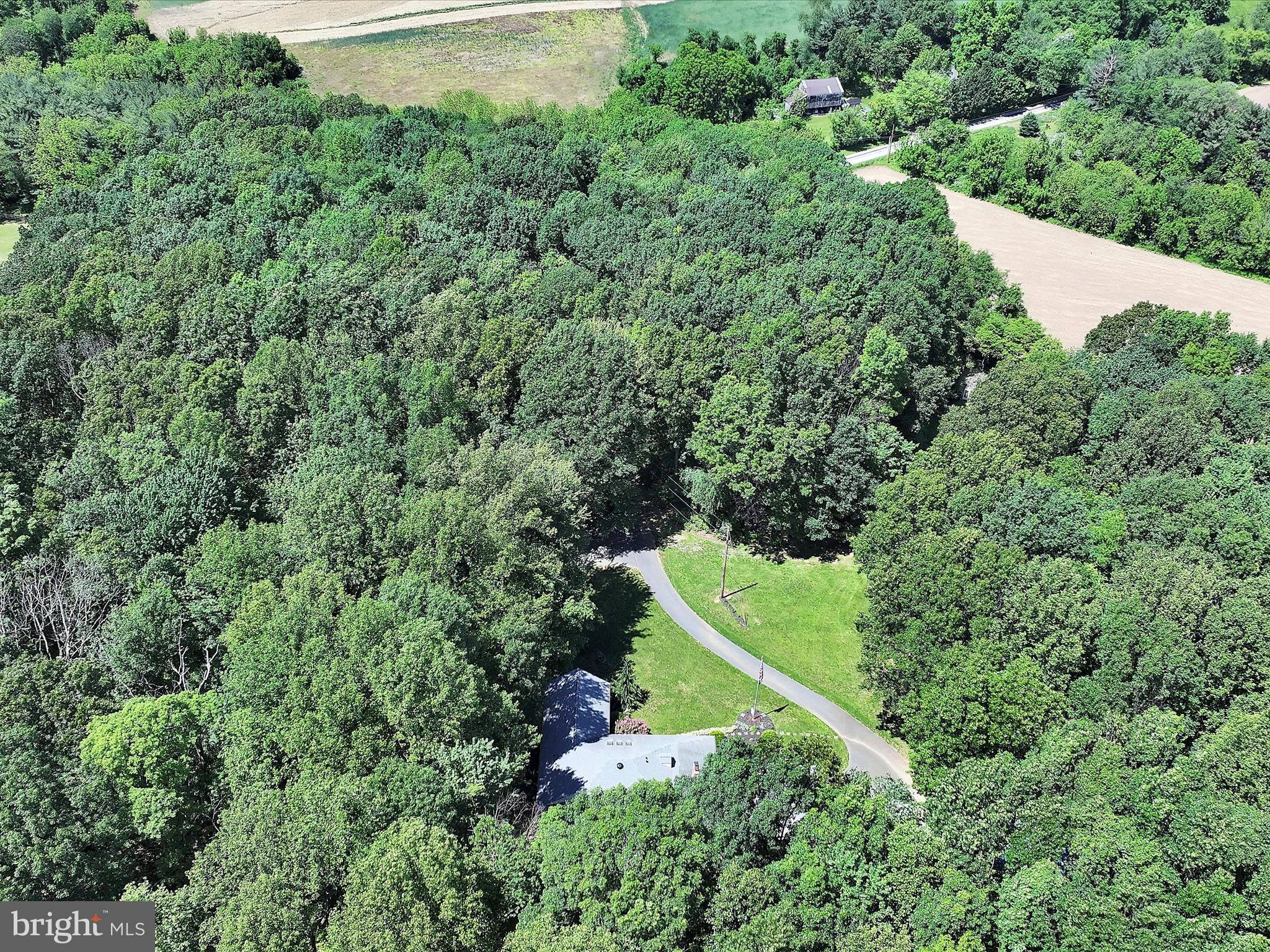 5150 Chestnut Grove Road Spring Grove, PA 17362 - Photo 54 of 56 an aerial view of a forest with a houses
