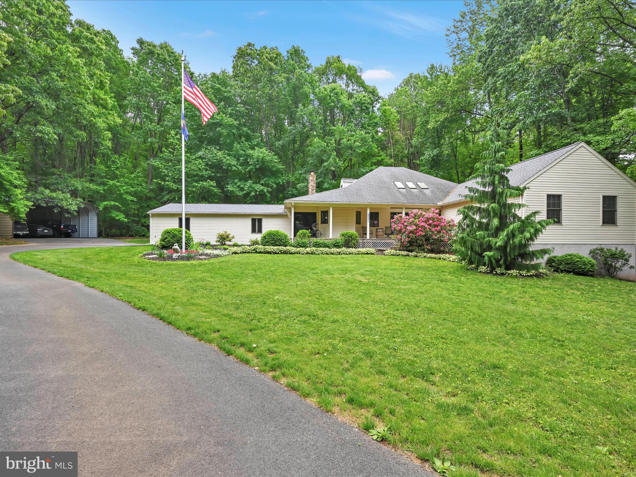 5150 Chestnut Grove Road Spring Grove, PA 17362 - Photo 6 of 56 a front view of a house with garden