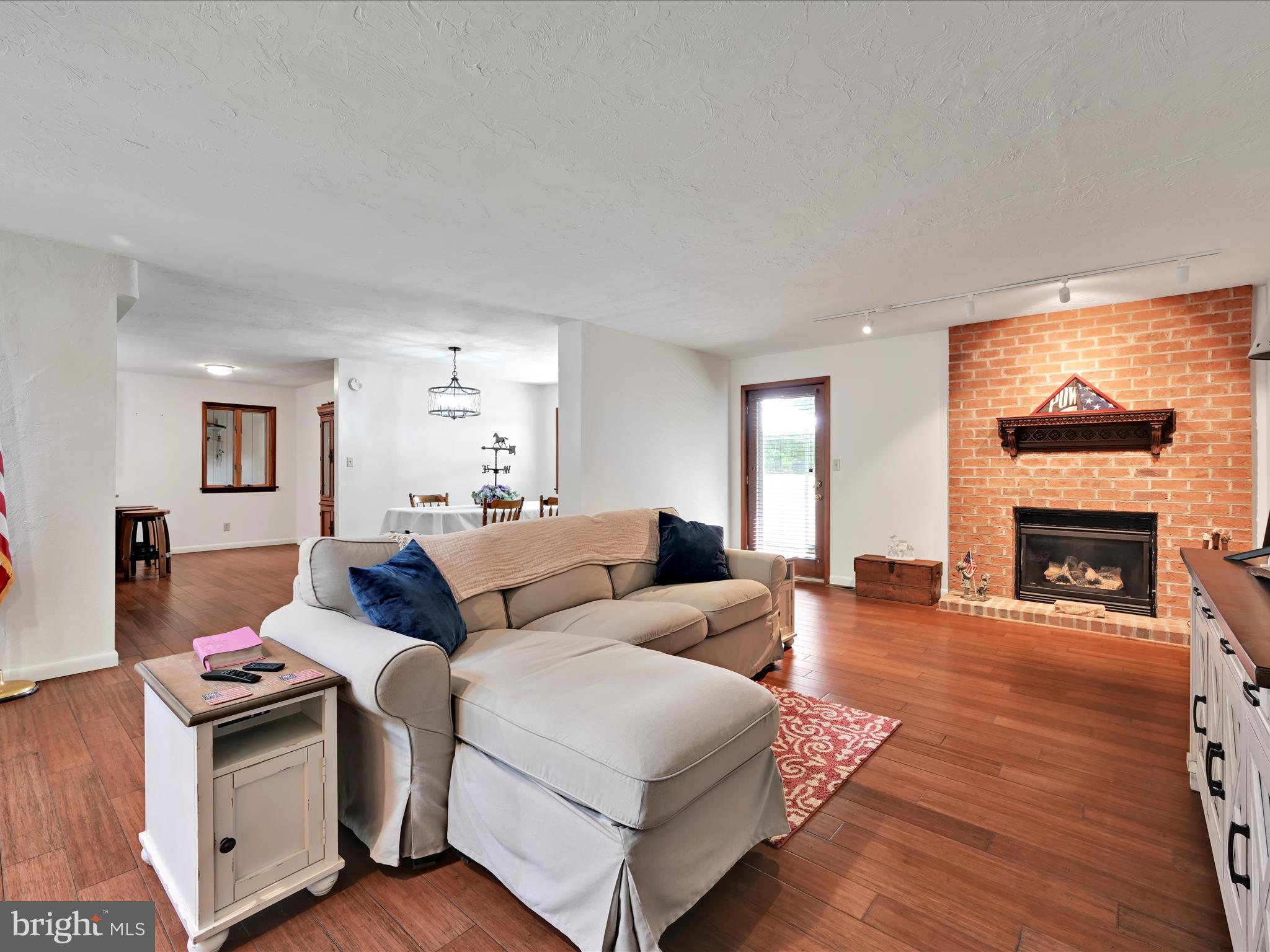 5150 Chestnut Grove Road Spring Grove, PA 17362 - Photo 7 of 56 a living room with furniture fireplace and window