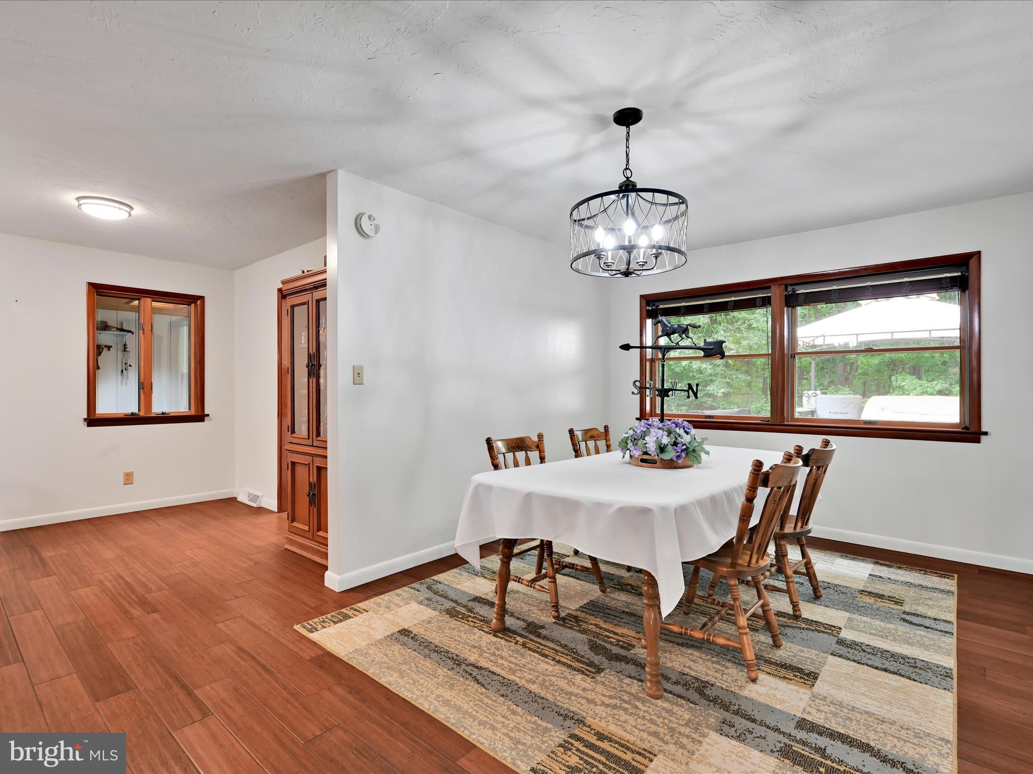 5150 Chestnut Grove Road Spring Grove, PA 17362 - Photo 9 of 56 a view of a dining room with furniture window and wooden floor