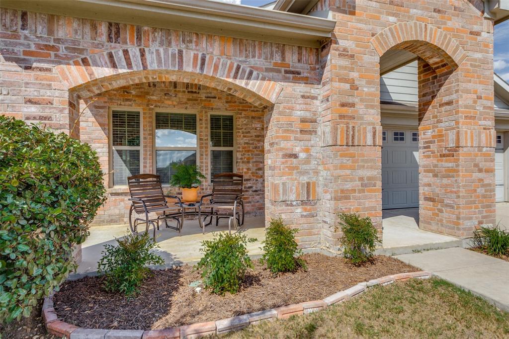 a front view of a house with outdoor seating