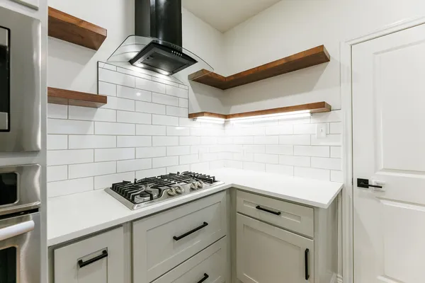 a kitchen with a stove and a sink