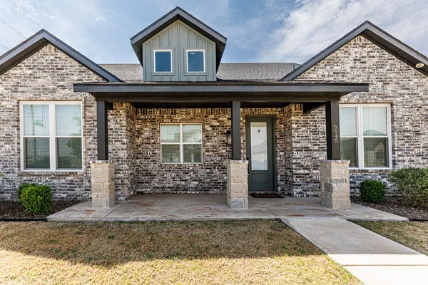 front view of a house with an outdoor space