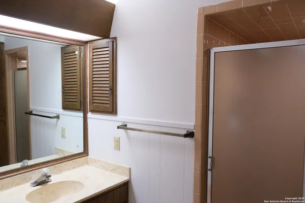 a bathroom with a sink and a mirror