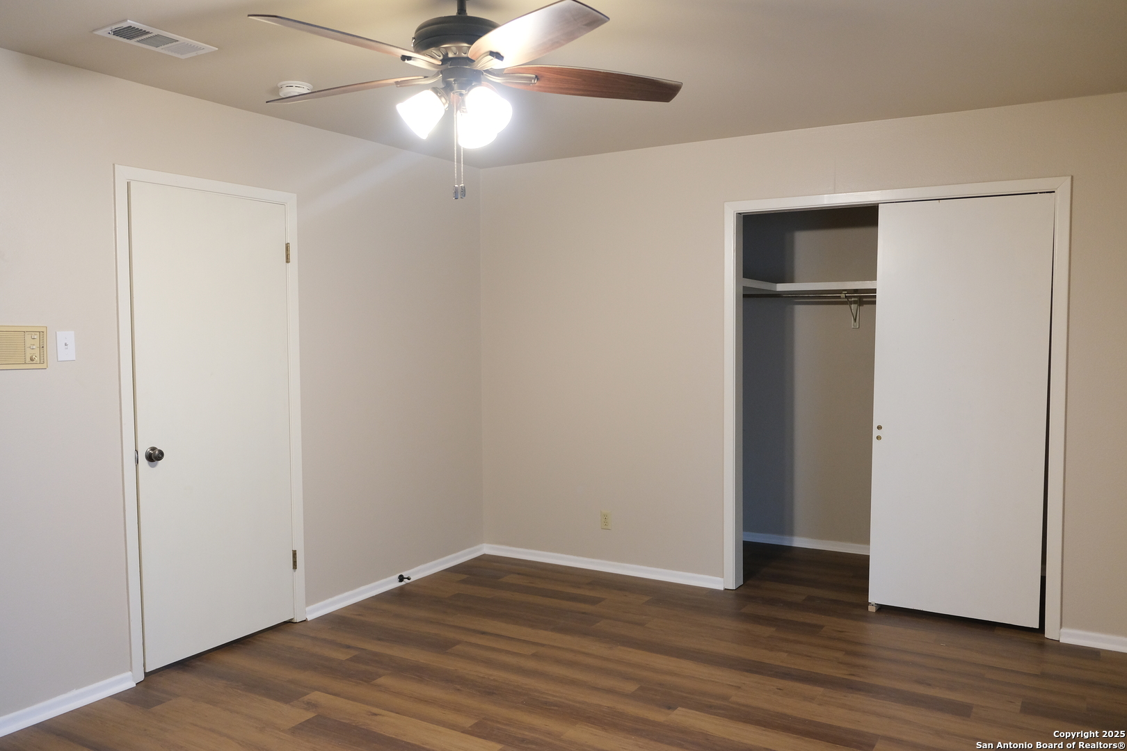 393 Fenwick Drive Windcrest, TX 78239 - Photo 34 of 42 a view of an empty room with wooden floor