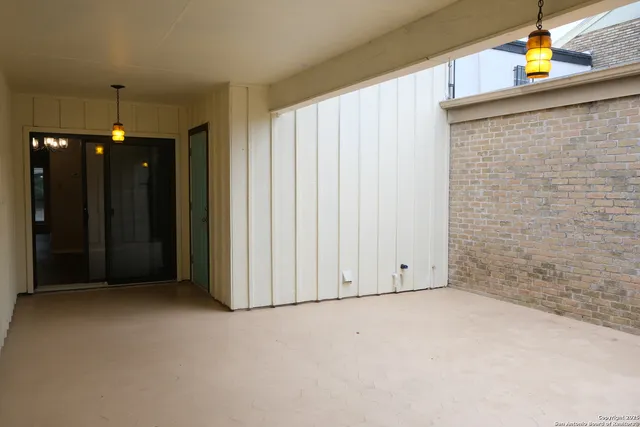 a view of a house with a tree