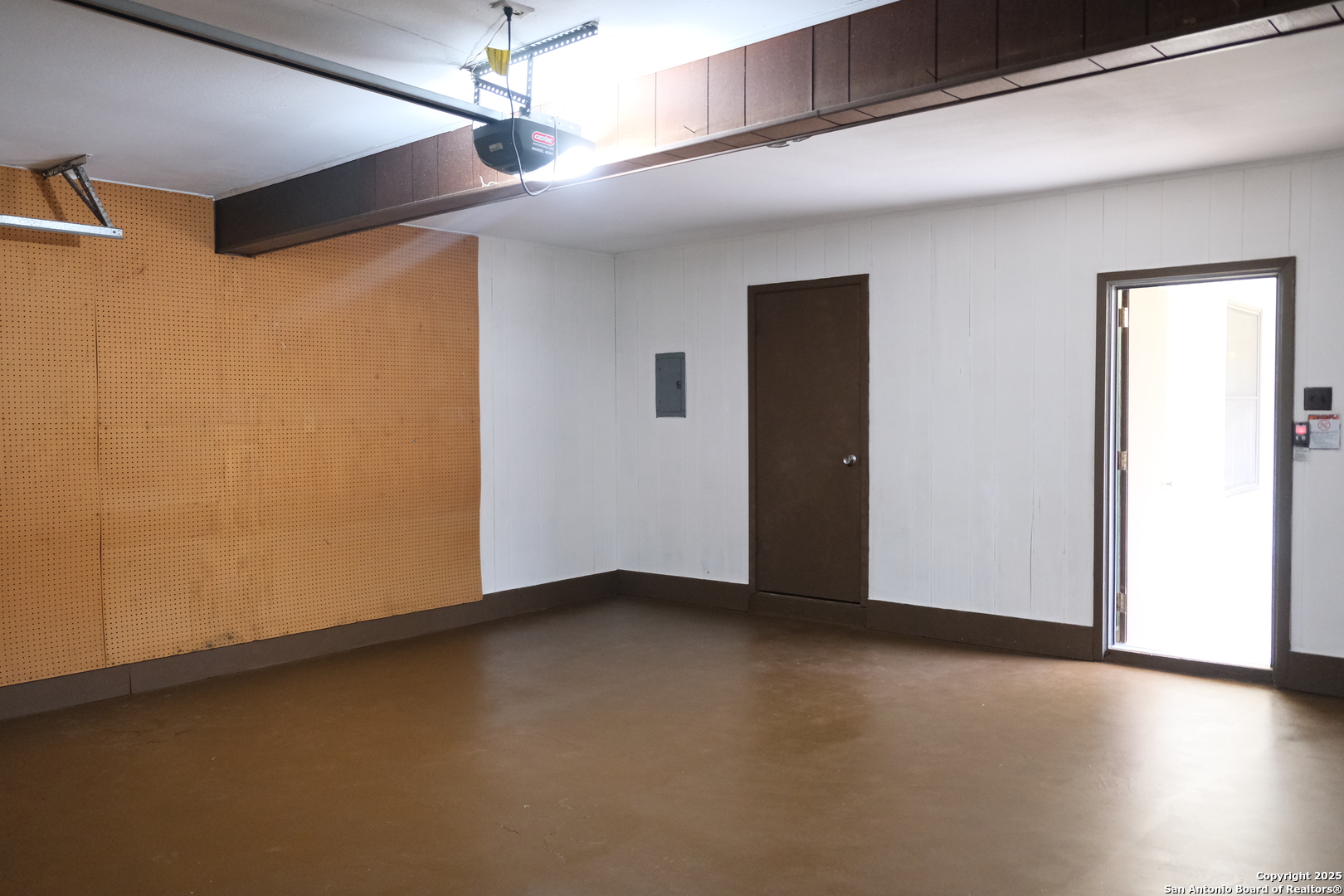 393 Fenwick Drive Windcrest, TX 78239 - Photo 41 of 42 an empty room with wooden floor and windows
