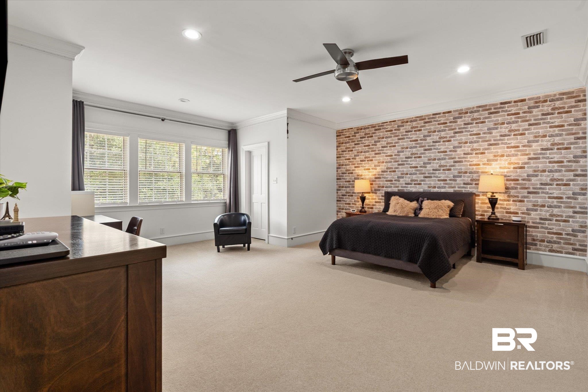 8561 Dawes Lake Road Mobile, AL 36619 - Photo 25 of 63 Bedroom featuring brick wall, ornamental molding, light carpet, recessed lighting, and a ceiling fan