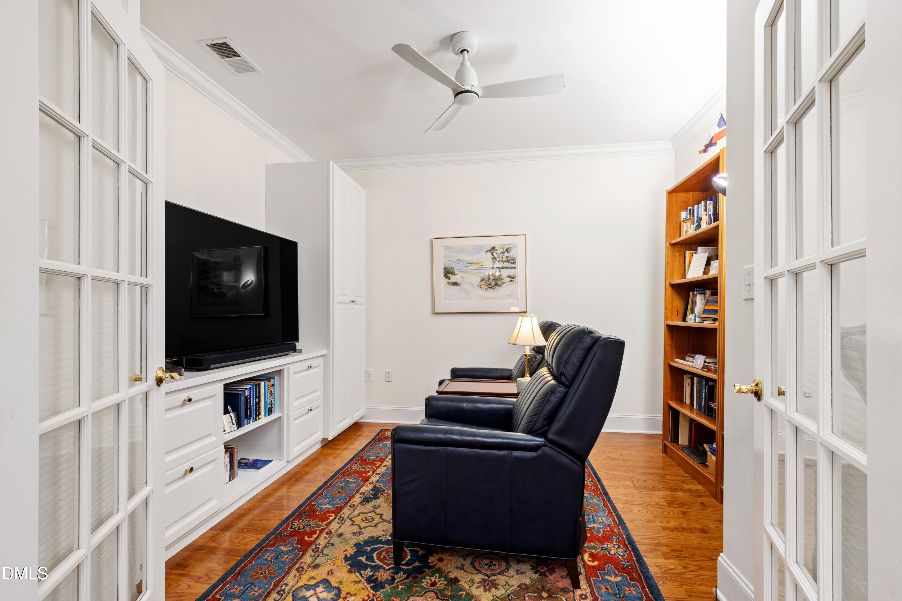3700 Baron Cooper Pass, Unit 105 Raleigh, NC 27612 - Photo 4 of 49 a living room with furniture and a flat screen tv