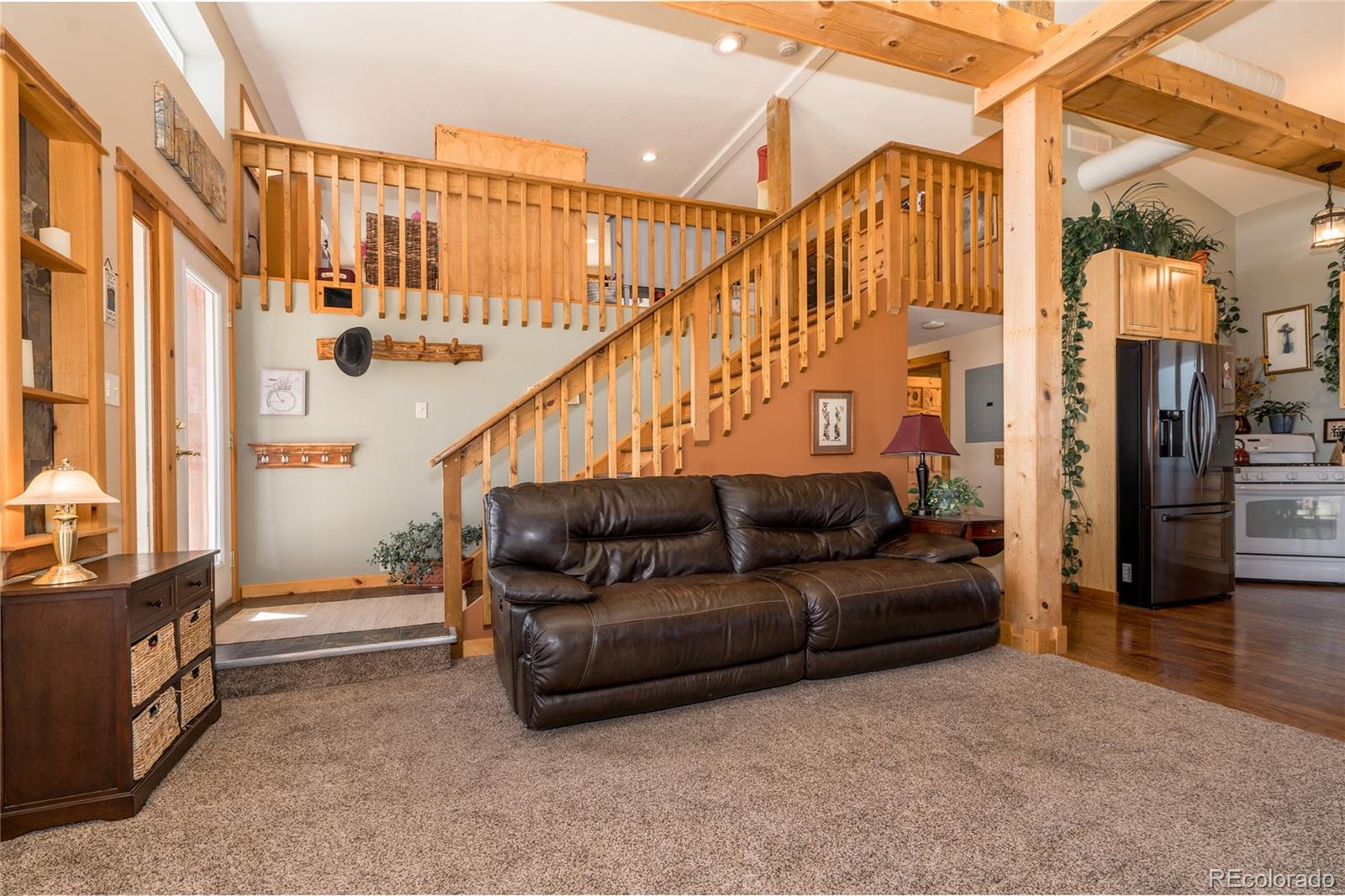 10320 Miners Lake Road Fort Collins, CO 80524 - Photo 7 of 39 a living room with furniture and a stairs