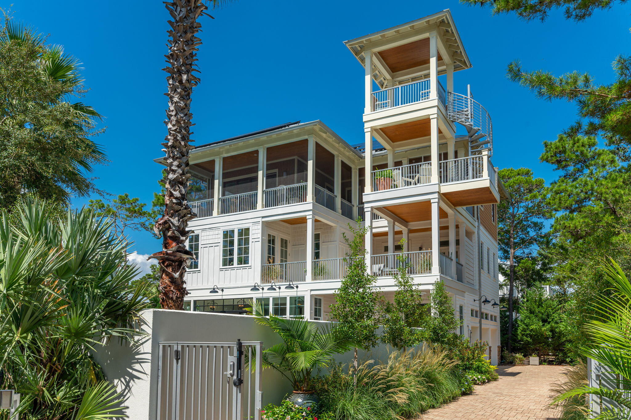 207 Betty Street Santa Rosa Beach, FL 32459 - Photo 24 of 27 a front view of a multi story residential apartment building with a yard