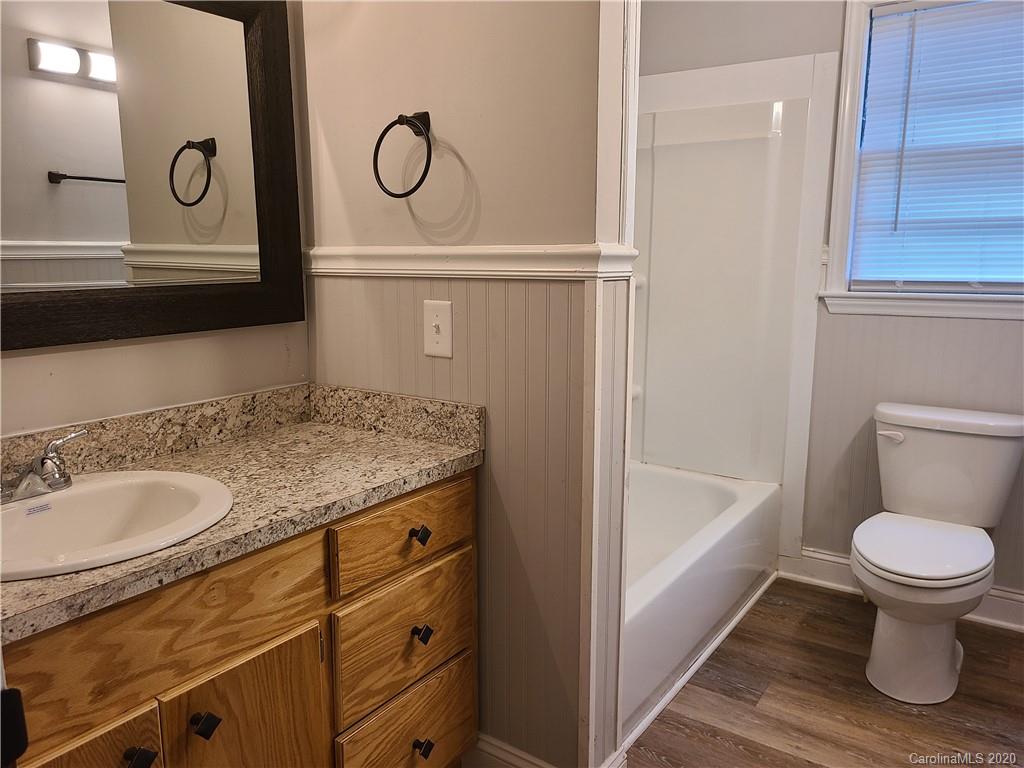 1820 Linwood Road Gastonia, NC 28052 - Photo 15 of 24 a bathroom with a granite countertop sink and a mirror