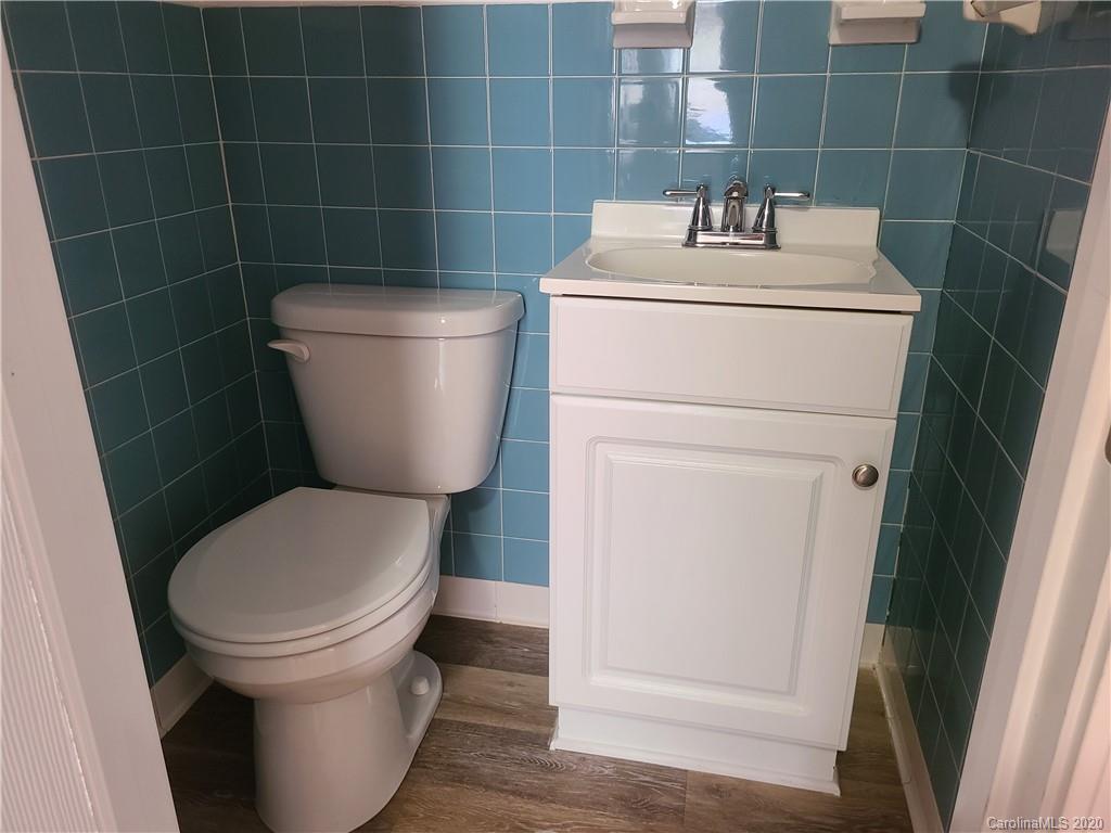 1820 Linwood Road Gastonia, NC 28052 - Photo 20 of 24 a bathroom with a toilet and a sink