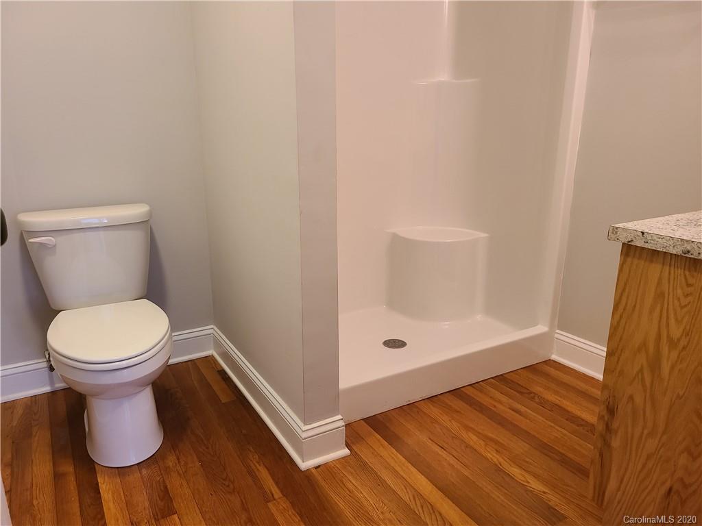 1820 Linwood Road Gastonia, NC 28052 - Photo 8 of 24 a bathroom with a toilet and a shower