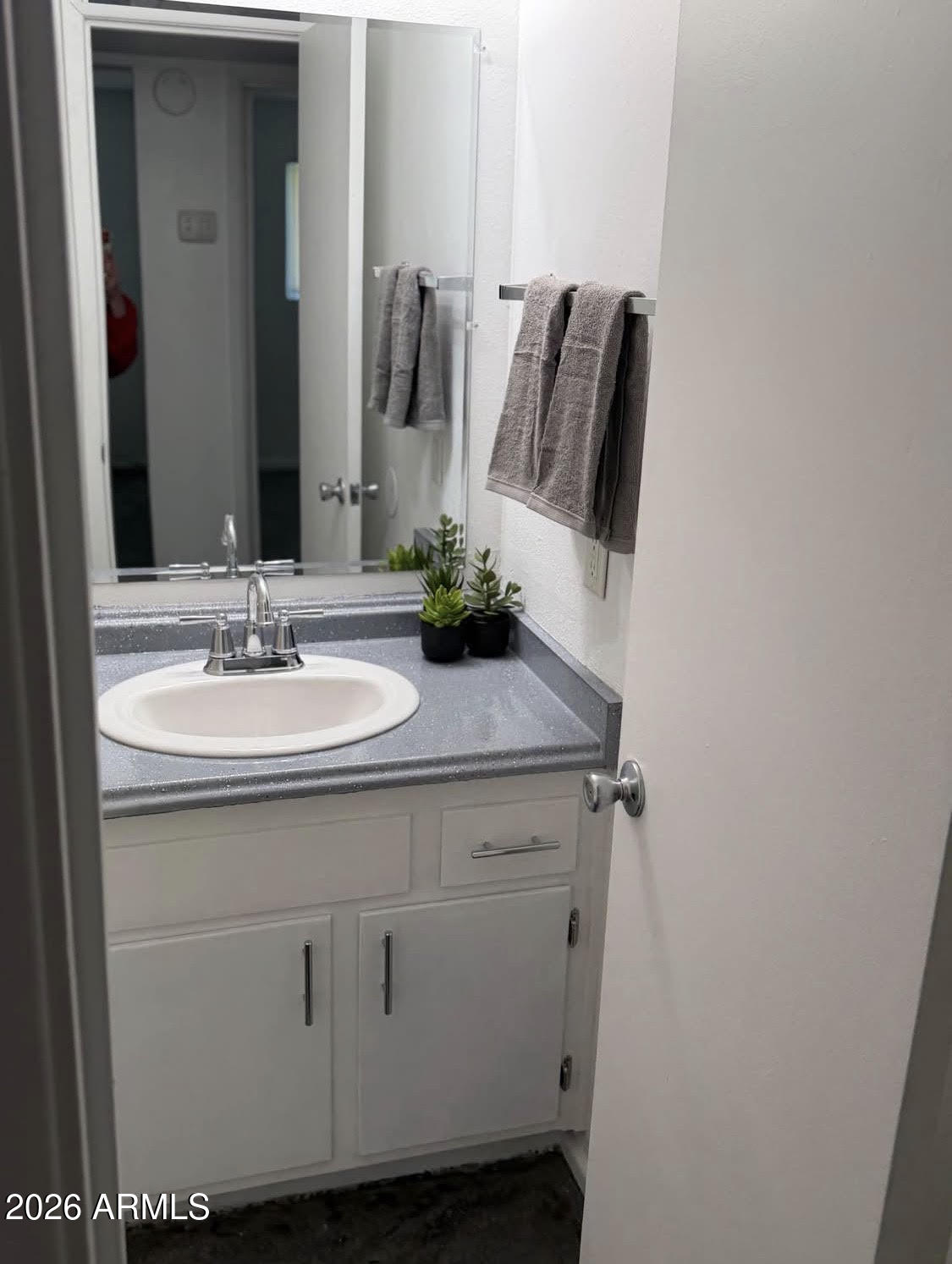 4337 West Keim Drive, Unit 4 Glendale, AZ 85301 - Photo 2 of 7 a bathroom with a sink and a mirror