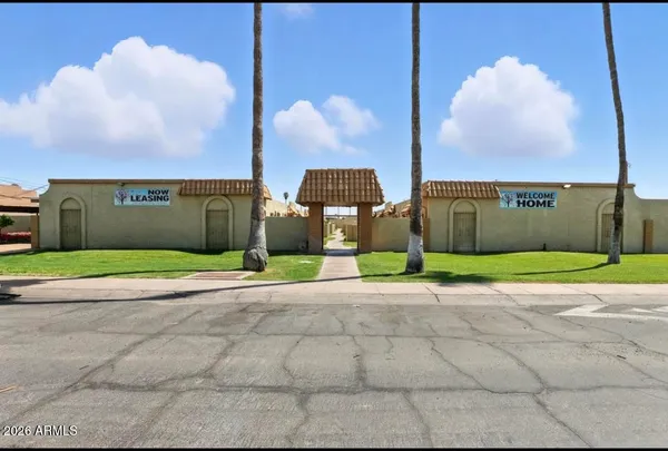 a view of a building with a yard