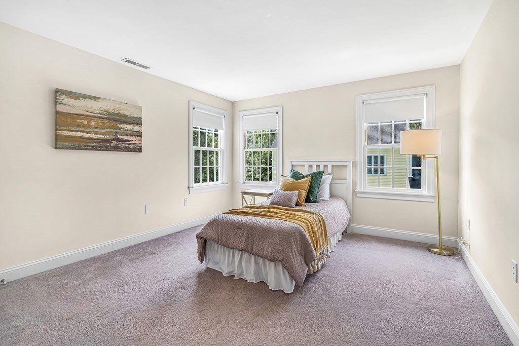 96 Pilgrim Road Concord, MA 01742 - Photo 18 of 24 a bedroom with a bed and a night stand