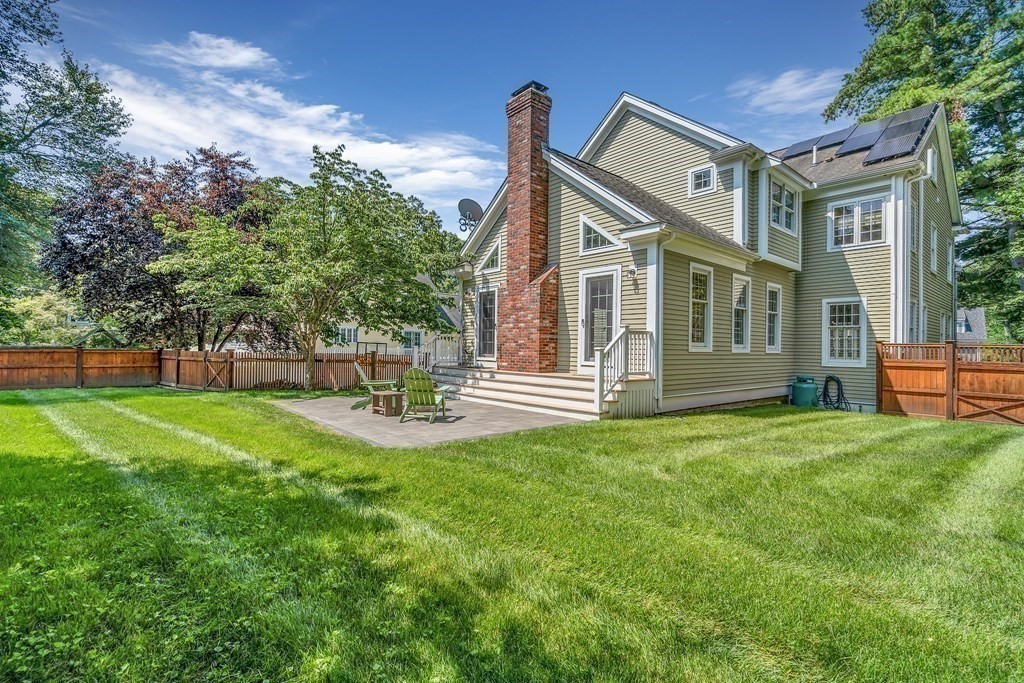 96 Pilgrim Road Concord, MA 01742 - Photo 20 of 24 a front view of a house with garden