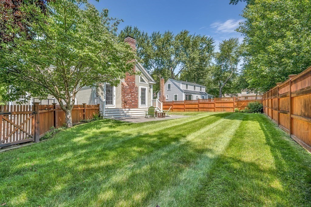 96 Pilgrim Road Concord, MA 01742 - Photo 21 of 24 a front view of a house with a yard