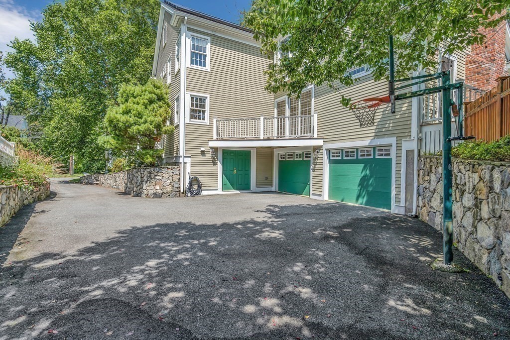 96 Pilgrim Road Concord, MA 01742 - Photo 22 of 24 a view of a house with a yard and large tree