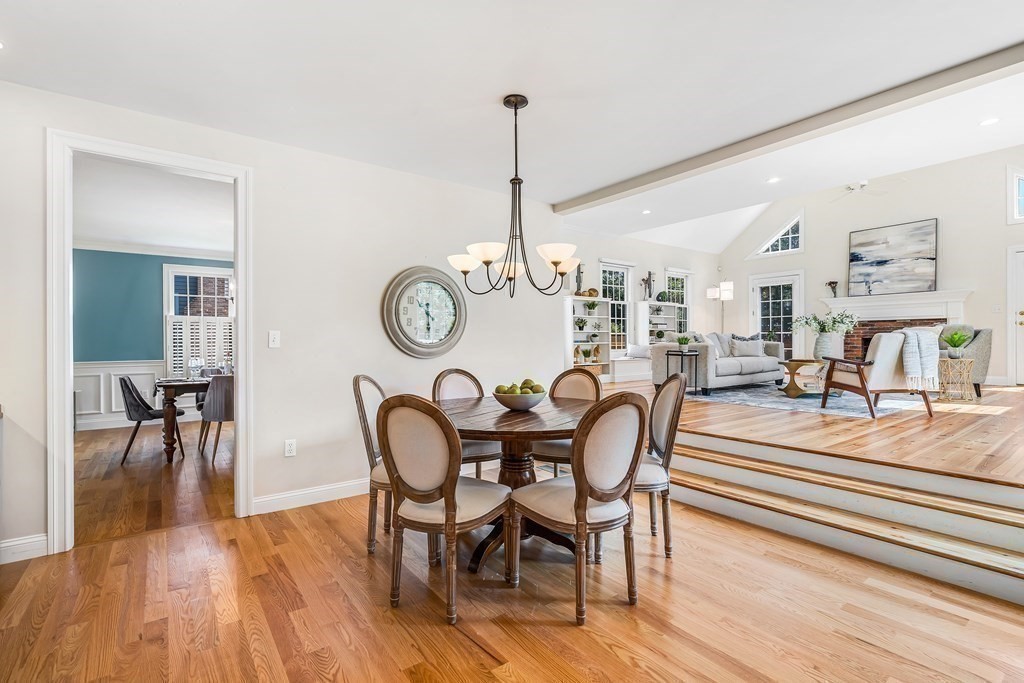 96 Pilgrim Road Concord, MA 01742 - Photo 7 of 24 a dining room with furniture a chandelier and wooden floor