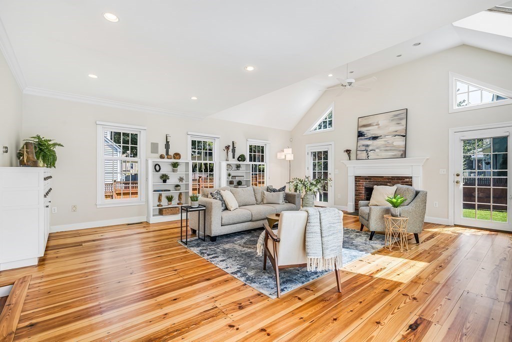 96 Pilgrim Road Concord, MA 01742 - Photo 9 of 24 a living room with fireplace furniture and a wooden floor