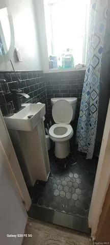 a bathroom with a toilet and a sink