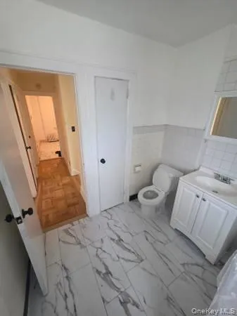 a bedroom with a bed and walk in closet