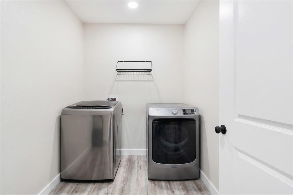 600 Private Road Brookston, TX 75421 - Photo 16 of 26 a utility room with dryer and washer