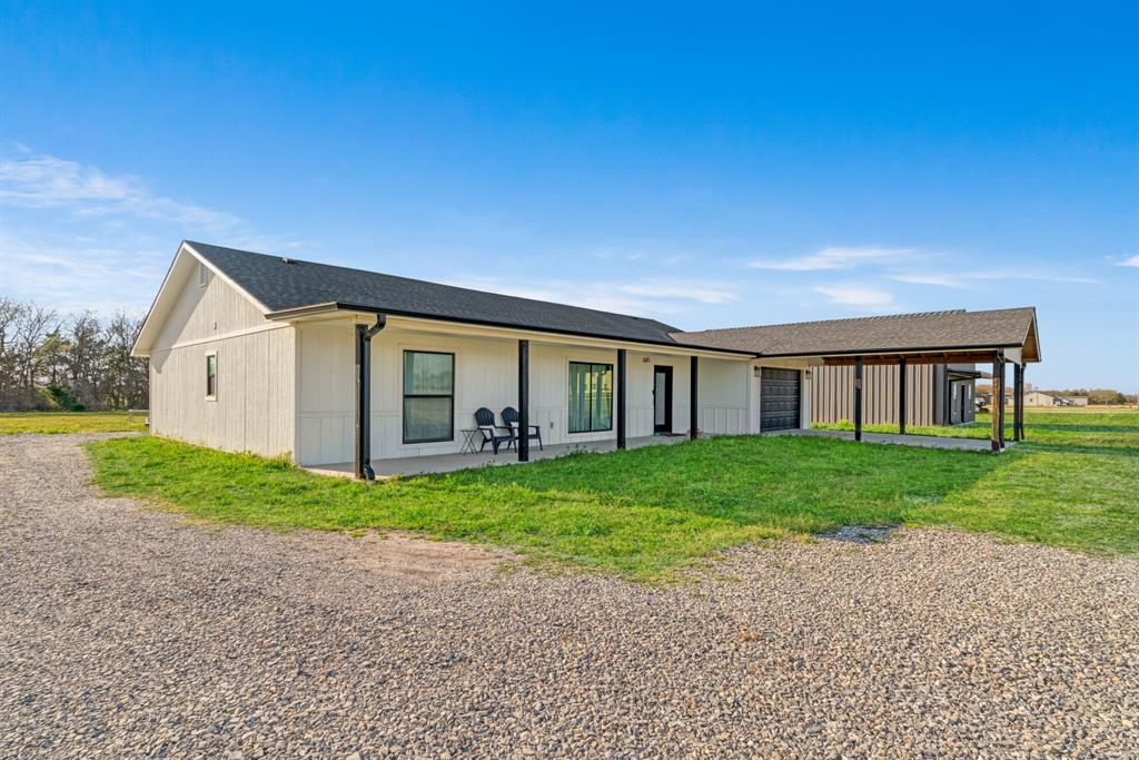 600 Private Road Brookston, TX 75421 - Photo 19 of 26 a view of a house with a backyard