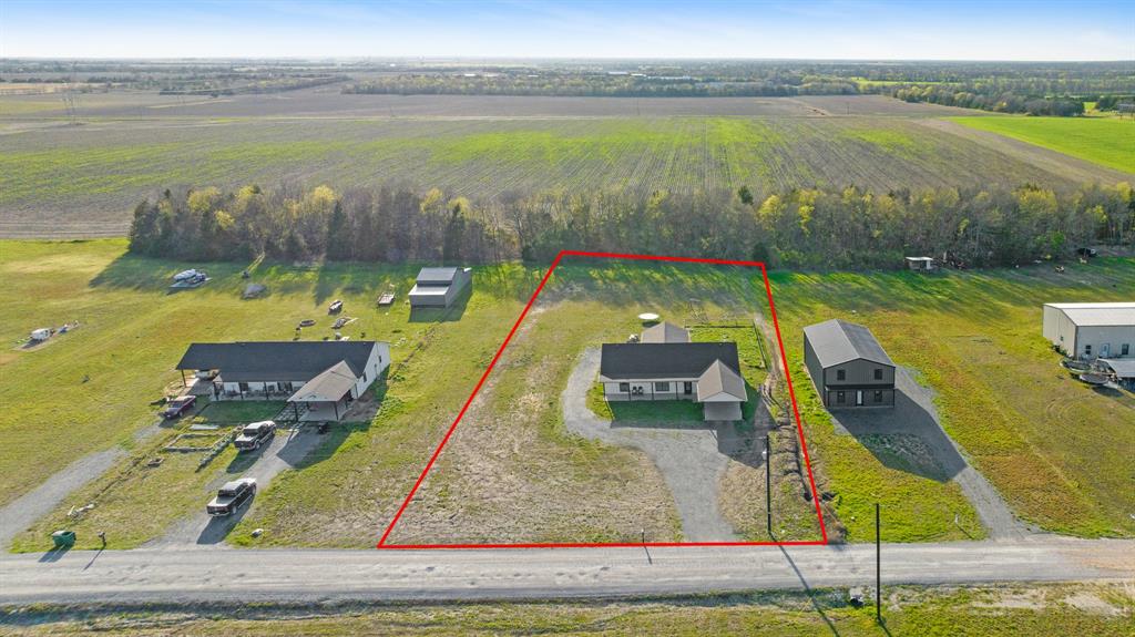 600 Private Road Brookston, TX 75421 - Photo 24 of 26 a view of a lake with a yard