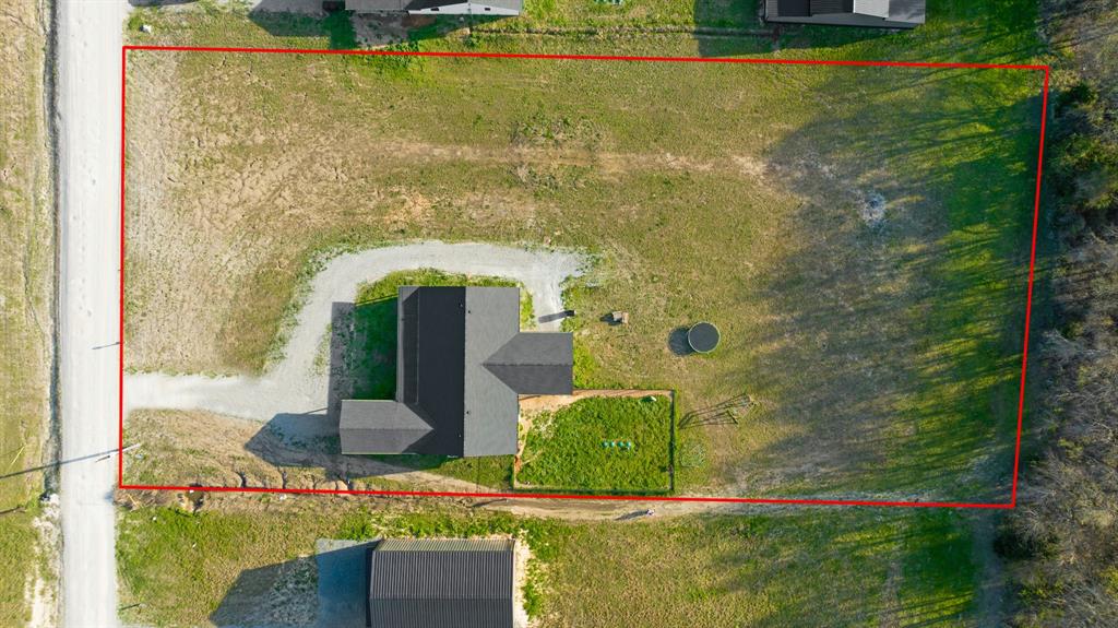 600 Private Road Brookston, TX 75421 - Photo 25 of 26 a front view of a house with garden