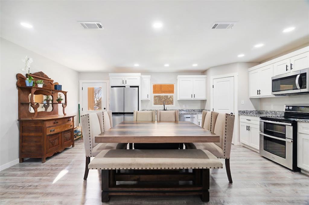 600 Private Road Brookston, TX 75421 - Photo 6 of 26 a large kitchen with a table and chairs