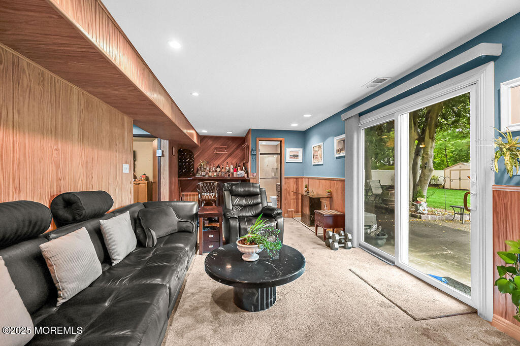308 Stone Road Hazlet, NJ 07730 - Photo 19 of 58 a living room with furniture and a large window