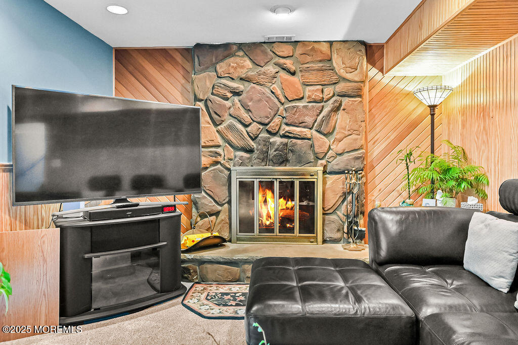 308 Stone Road Hazlet, NJ 07730 - Photo 20 of 58 a living room with a couch and a fireplace