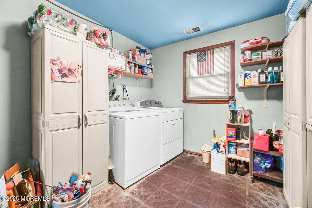 308 Stone Road Hazlet, NJ 07730 - Photo 23 of 58 a storage room with a lot of stuff and white cabinets