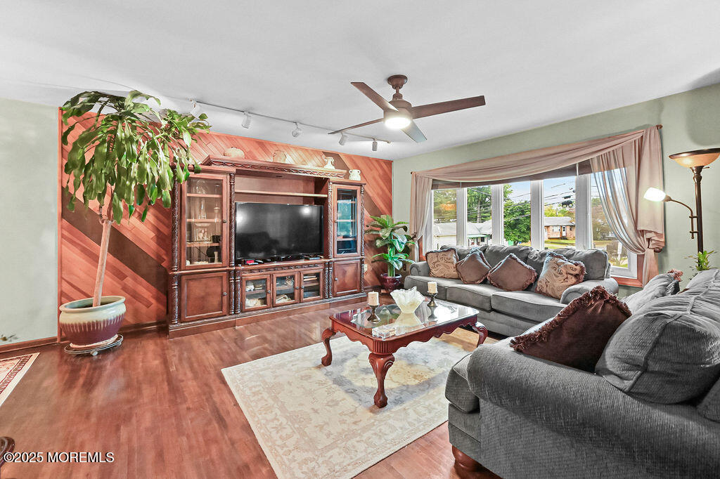 308 Stone Road Hazlet, NJ 07730 - Photo 34 of 58 a living room with furniture and a flat screen tv