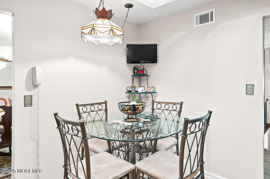 308 Stone Road Hazlet, NJ 07730 - Photo 35 of 58 a view of a dining room with furniture and wooden floor