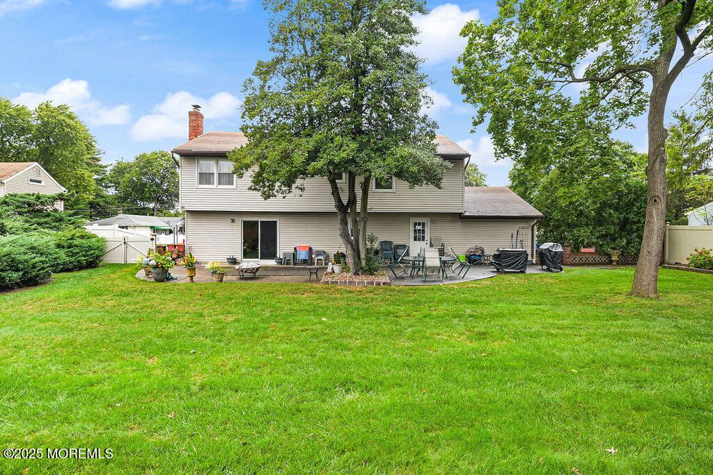 308 Stone Road Hazlet, NJ 07730 - Photo 38 of 58 a front view of house with yard and seating area