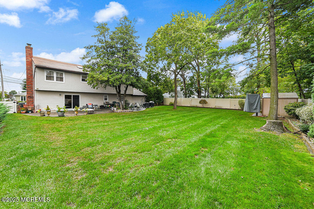 308 Stone Road Hazlet, NJ 07730 - Photo 39 of 58 a view of a house with a big yard and large trees