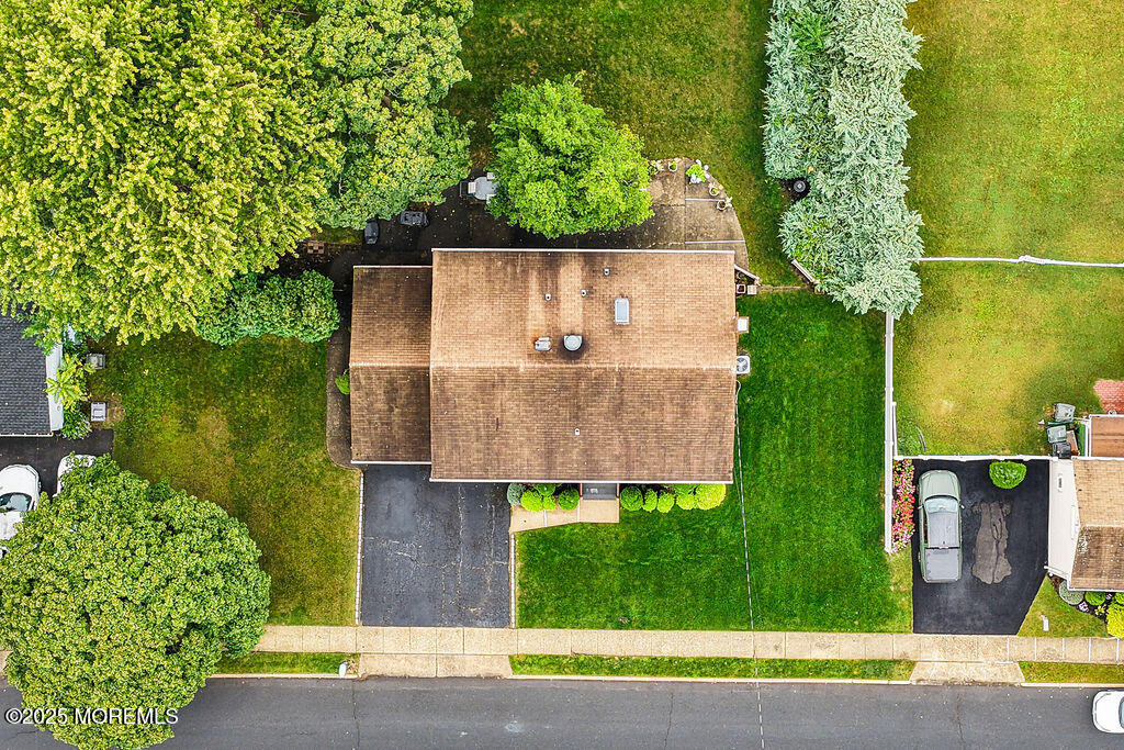 308 Stone Road Hazlet, NJ 07730 - Photo 48 of 58 an aerial view of a house with a garden and large trees