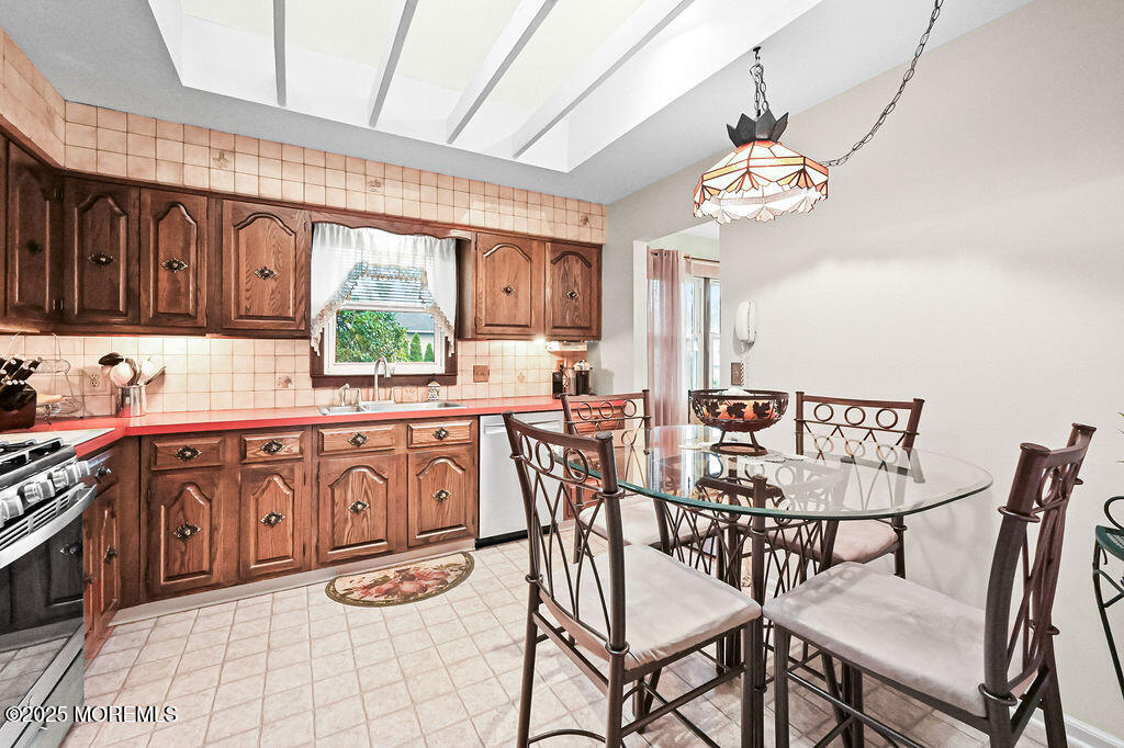 308 Stone Road Hazlet, NJ 07730 - Photo 6 of 58 a view of a dining room with furniture window and outside view