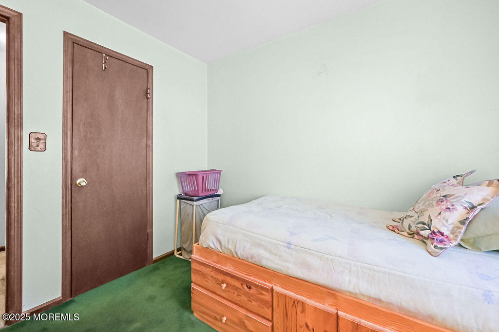 308 Stone Road Hazlet, NJ 07730 - Photo 8 of 58 a bedroom with a bed and hallway