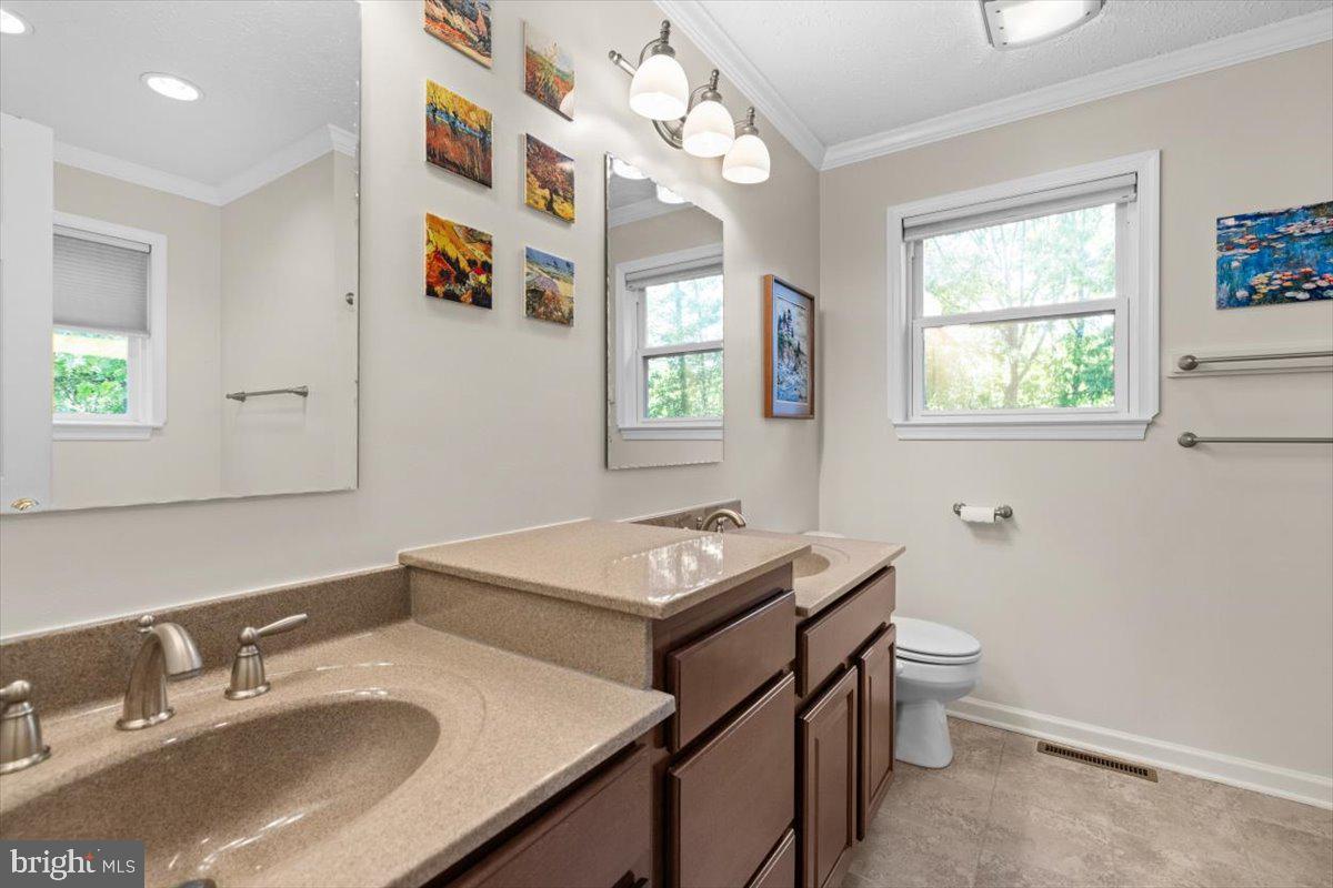 116 Ware Place Winchester, VA 22602 - Photo 18 of 28 a bathroom with a sink vanity granite and a mirror