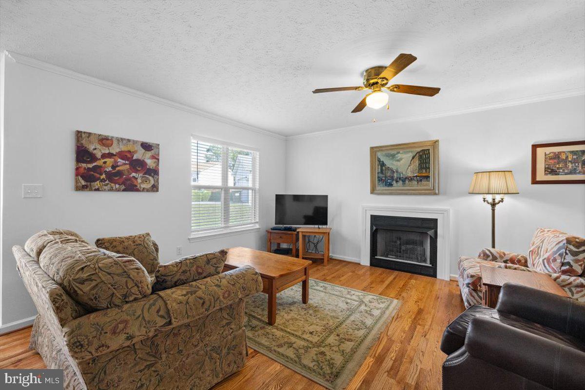 116 Ware Place Winchester, VA 22602 - Photo 2 of 28 a living room with furniture a flat screen tv and a fireplace