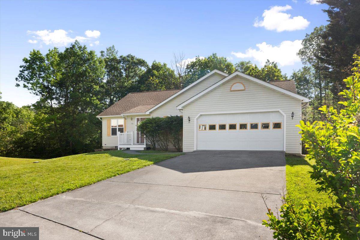 116 Ware Place Winchester, VA 22602 - Photo 27 of 28 a front view of a house with a yard and garage