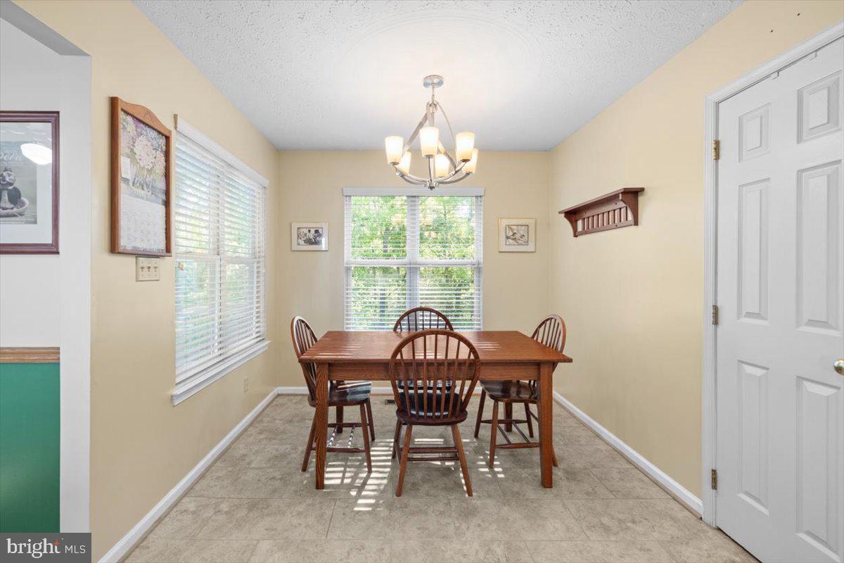 116 Ware Place Winchester, VA 22602 - Photo 10 of 28 a view of a dining room with furniture window and outside view