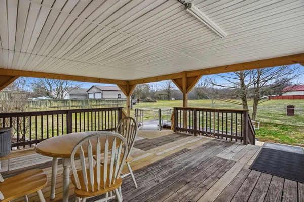 a view of a two chairs in the deck