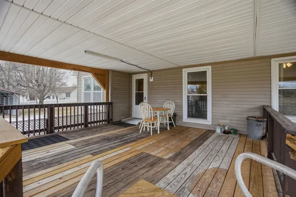 a view of a balcony with chairs