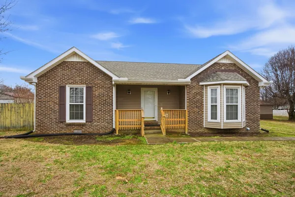 front view of a house with a yard
